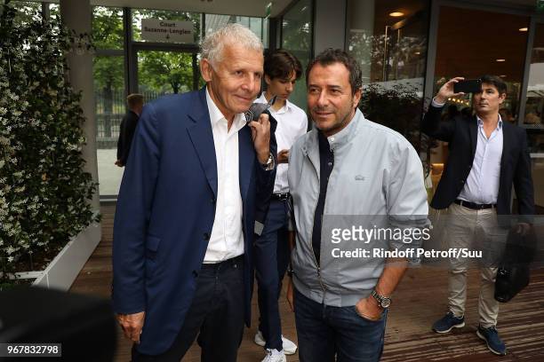 Journalist Patrick Poivre D'arvor and tv host Bernard Montiel attend the 2018 French Open - Day Ten at Roland Garros on June 5, 2018 in Paris, France.