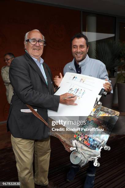 Tv host Bernard Montiel poses with painter Joel Blanc attend the 2018 French Open - Day Ten at Roland Garros on June 5, 2018 in Paris, France.