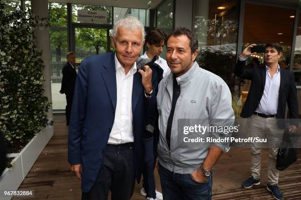 Journalist Patrick Poivre D'arvor and tv host Bernard Montiel attend the 2018 French Open - Day Ten at Roland Garros on June 5, 2018 in Paris, France.