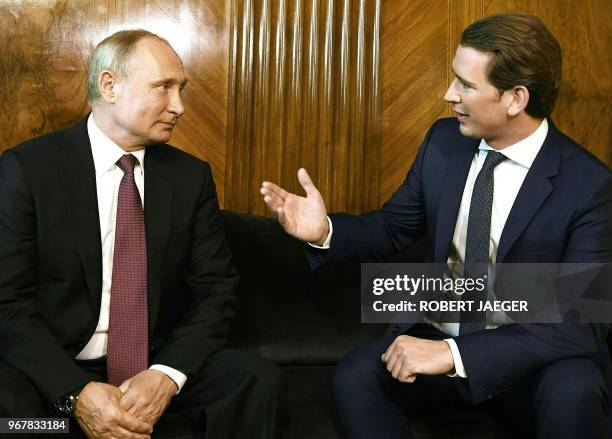 Austria's Chancellor Sebastian Kurz welcomes Russian President Vladimir Putin during a one-day visit in Vienna, Austria, on June 5, 2018. / Austria...