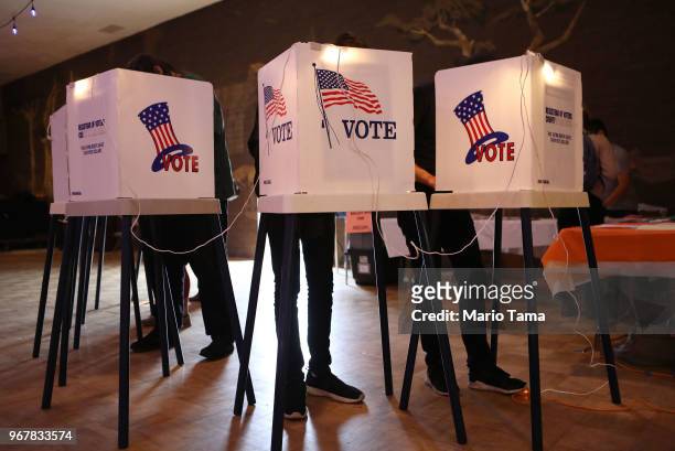 Voters cast their ballots at a Masonic Lodge on June 5, 2018 in Los Angeles, California. California could play a determining role in upsetting...