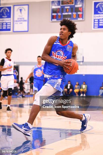 Richard Springs from The MacDuffie School drives to the basket during the Pangos All-American Camp on June 2, 2018 at Cerritos College in Norwalk, CA.