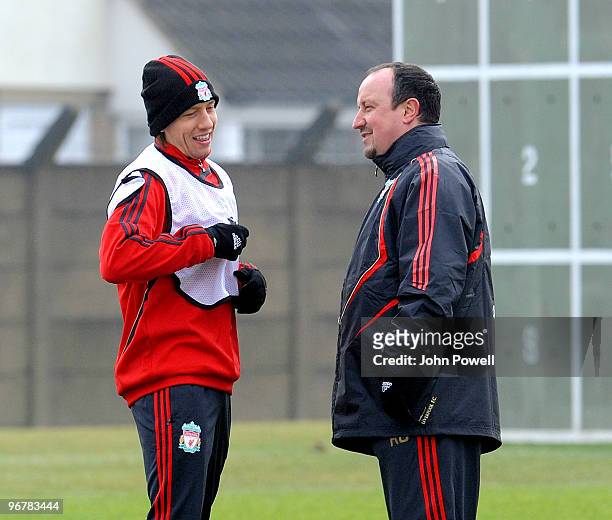 Rafa Benitez manager of Liverpool talks with Lucas Leiva during a training session ahead of their UEFA Europa League round of 32 first-leg match...