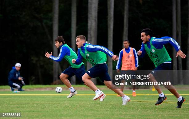 Paraguayan national football team players Oscar Romero , Robert Piris and Derlis Gomez, take part in a training session at Albiroga training center,...