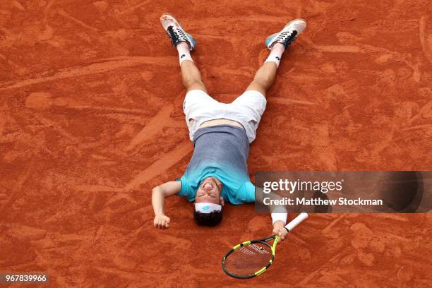 Marco Cecchinato of Italy celebrates victory during the mens singles quarter finals match against Novak Djokovic of Serbia during day ten of the 2018...