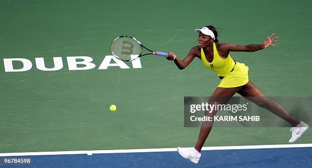 Tennis champion Venus Williams returns the ball to Olga Govortsova of Belarus during the two million dollar WTA Dubai Open championship in the Gulf...