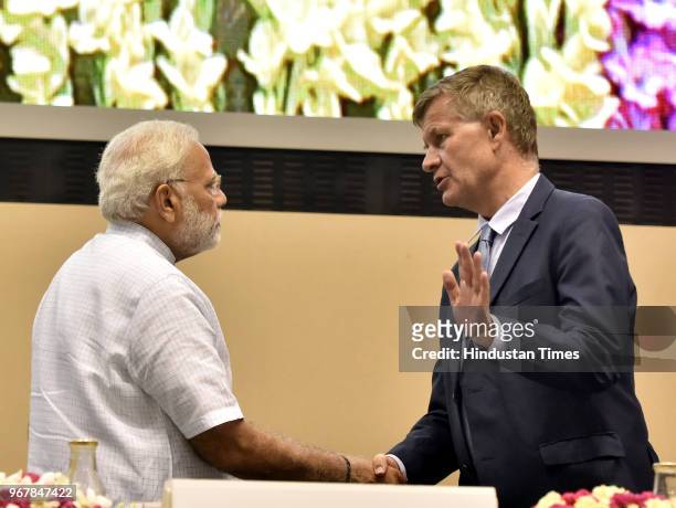 Prime Minister of India Narendra Modi is seen talking with Executive Director of the United Nations Environment Programme Erik Solheim during the...