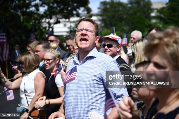 Protester shouts at US President Donald Trump as he speaks at the "Celebration of America" at the White House in Washington, DC, on June 5, 2018. -...