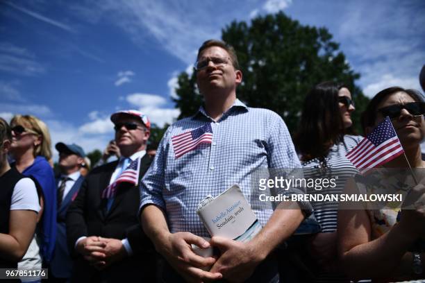 Protester shouts at US President Donald Trump as he speaks at the "Celebration of America" at the White House in Washington, DC, on June 5, 2018. -...