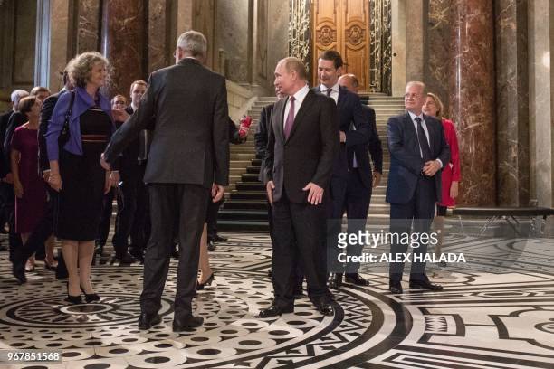 Austrian Federal President Alexander Van der Bellen, Russian President Vladimir Putin and Austrian Chancellor Sebastian Kurz arrive to the...