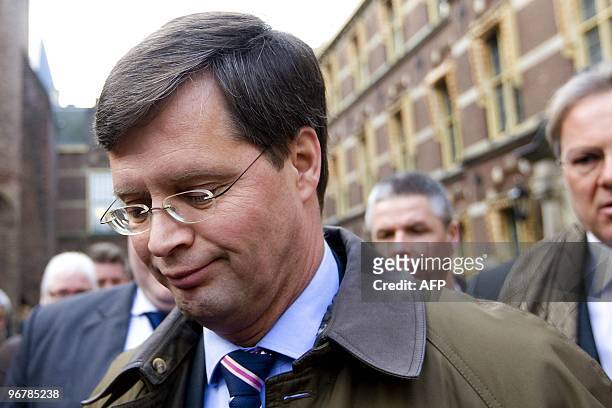 Dutch Prime minister Jan Peter Balkenende leaves the Binnenhof in The Hague, on February 17, 2010 after gathering with a few ministers to deliberate...
