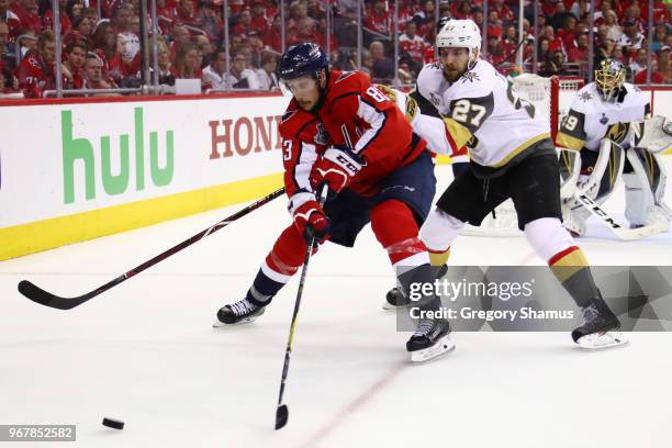 Jay Beagle of the Washington Capitals is pursued by Shea Theodore of the Vegas Golden Knights during the second period in Game Four of the 2018 NHL...