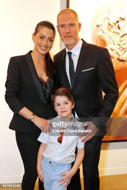 Jean-David Malat poses with wife Iriane Malat and son Joshua Malat at the Grand Opening of JD Malat Gallery in Mayfair on June 5, 2018 in London,...