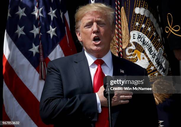 President Donald Trump sings the national anthem during a "Celebration of America" event on the south lawn of the White House June 5, 2018 in...