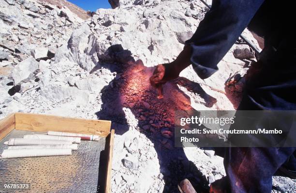 Worker prepares dynamite to extract Lapis Lazuli in the Flores de Los Andes mine, located at 3,700 meter high in the Andes, on April 1 near Ovalle,...