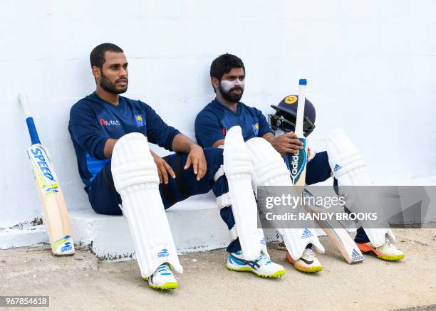 Roshen Silva and Niroshan Dickwella from Sri Lanka take part in a training session one day ahead of the Cricket 1st Test between West Indies and Sri...