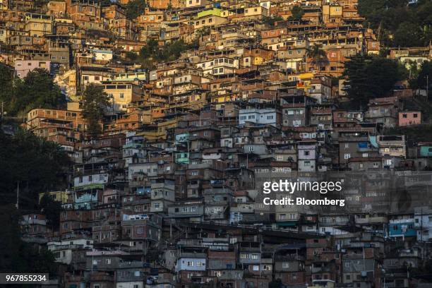 Homes stand at dawn in the Prazeres neighborhood of Rio de Janeiro, Brazil, on Wednesday, May 30, 2018. A 38-year-old black, bisexual woman won a...