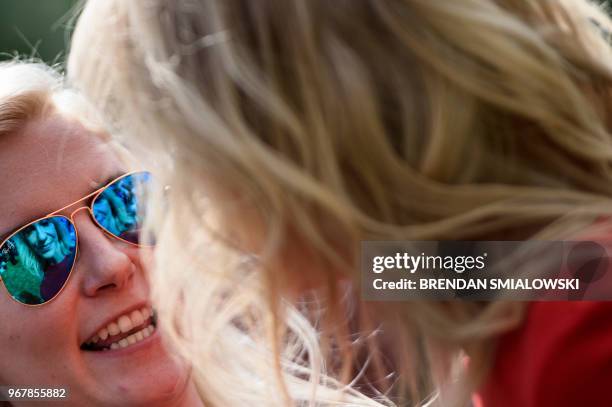 Woman talks with Counselor to the President Kellyanne Conway during an event on the South Lawn of the White House in place of the previously schedule...