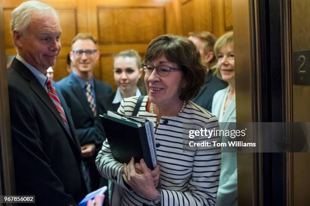 Sen. Susan Collins, R-Maine, talks with reporters after the Senate Policy luncheons in the Capitol on June 5, 2018. Sens. Ron Johnson, R-Wis., left,...