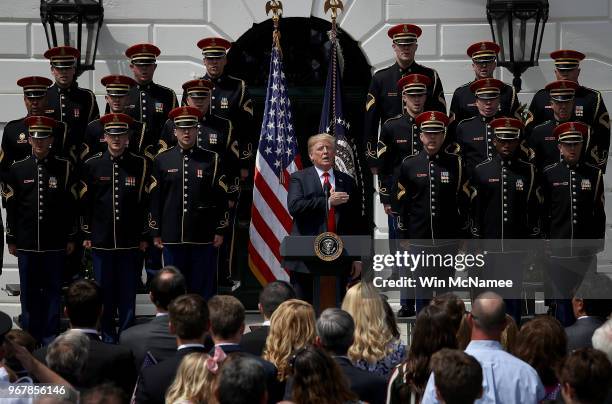 President Donald Trump sings the national anthem with a U.S. Army chorus during a "Celebration of America" event on the south lawn of the White House...