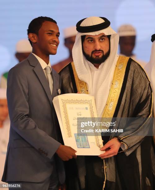Emirati Sheikh Ahmed bin Mohammed bin Rashid al Maktoum awards awards the best Koran reader to US Huzafi Saiq at the Dubai International Holy Quran...