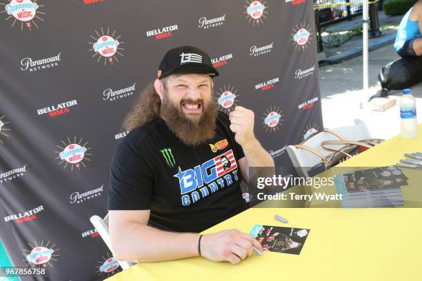 Roy Nelson signs autographs at CMT Music Awards and Bar-S Block Party at Schermerhorn Symphony Center Plaza on June 5, 2018 in Nashville, Tennessee.