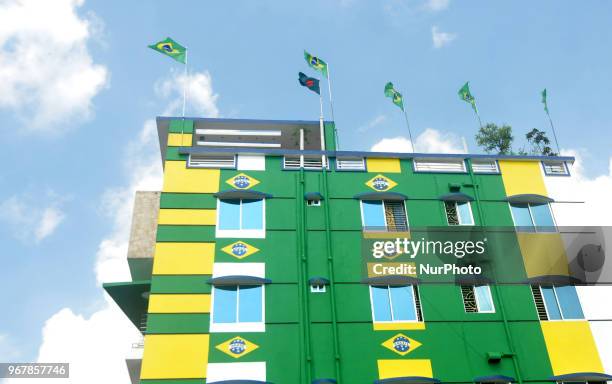 An enthusiast supporter of Brazilian football team decorates his home at Narayanganj of Bangladesh with Brazilian national flag ahead of the World...