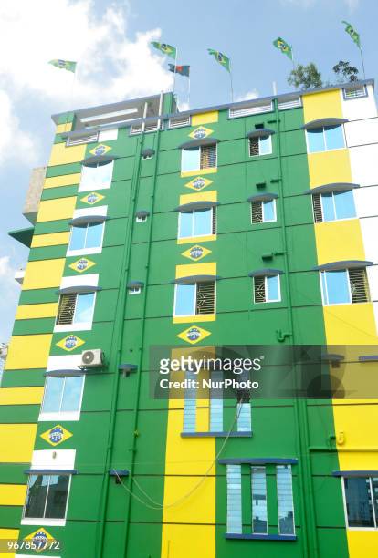 An enthusiast supporter of Brazilian football team decorates his home at Narayanganj of Bangladesh with Brazilian national flag ahead of the World...