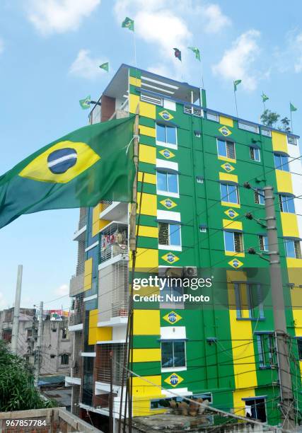 An enthusiast supporter of Brazilian football team decorates his home at Narayanganj of Bangladesh with Brazilian national flag ahead of the World...