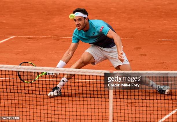Marco Cecchinato of Italy hits a forehand against Novak Djokovic of Serbia in the Quarter Finals of the men's singles during the French Open at...
