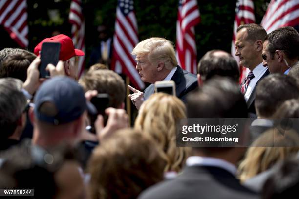 President Donald Trump, center, gestures during a Celebration of America event on the South Lawn of the White House in Washington, D.C., U.S., on...