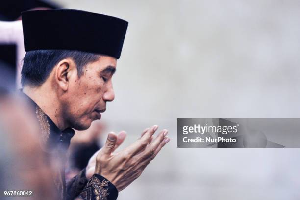 Indonesian President Joko Widodo prays during Nuzulul Quran event at Presidential Merdeka Palace in Jakarta, Indonesia on June 5, 2018.