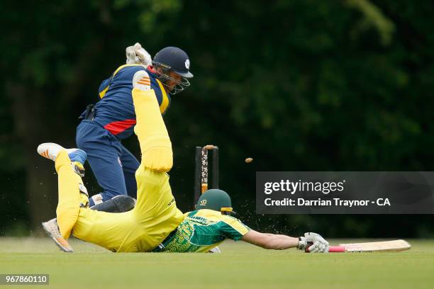 Ben Patterson of the Australian Indigenous Men's cricket team dives to avois a runout at Arundel cricket ground in the match against the MCC on June...