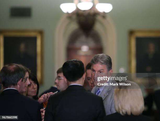 Sen. Joe Manchin speaks to a reporter after attending the Senate Democrats policy luncheon June 5, 2018 in Washington, DC. Moments earlier Senate...