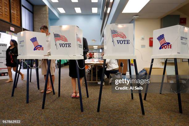 Richard Montoya and his wife Consuelo Montoya cast their ballots June 5, 2018 at the Robert F. Kennedy Elementary School in the City Terrace...