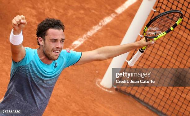 Marco Cecchinato of Italy celebrates his victory over Novak Djokovic of Serbia during Day 10 of the 2018 French Open at Roland Garros stadium on June...