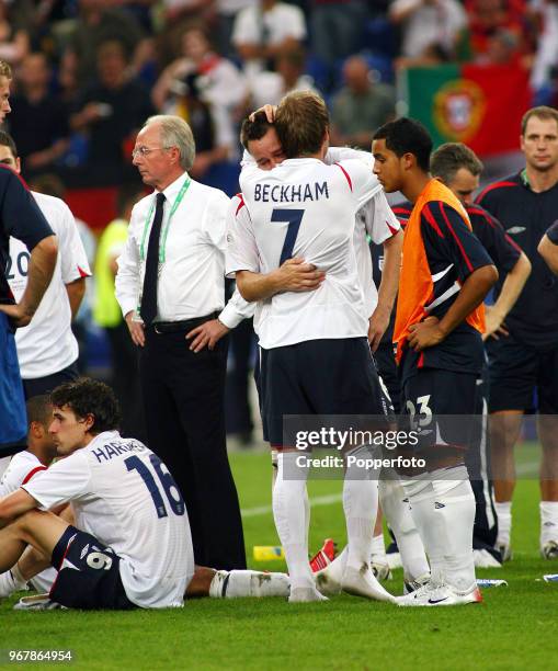 Tearful John Terry of England is consoled by teammate David Beckham as manager Sven Goran Eriksson looks on dejectedly following the FIFA World Cup...