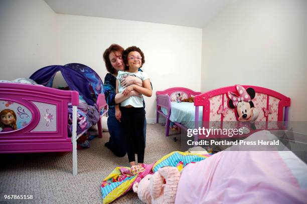 Christina Paul and her daughter Zoé Paul pose for a portrait on Wednesday in the bedroom Zoé shares with her younger sister. For Zoé, who was born...
