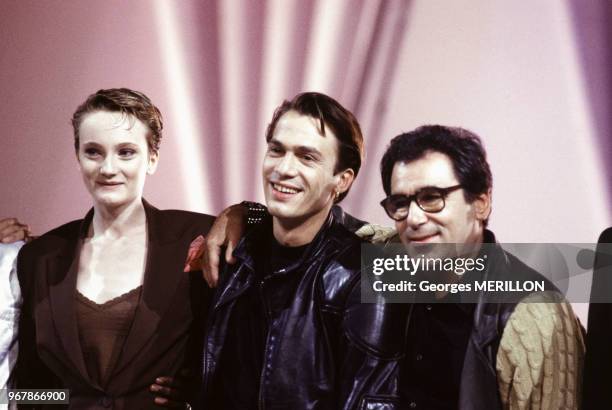 Florent Pagny avec Patricia Kaas et Claude Nougaro lors d'une soirée le 19 novembre 1988 à Paris, France.
