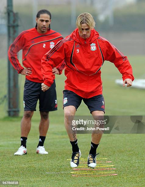 Back on the ball after their injuries, Glen Johnson and Fernando Torres in action during a training session at Melwood Training Ground on February...