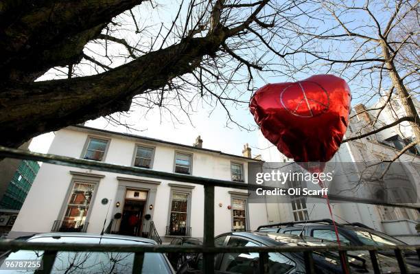 Red, heart-shaped balloon is attached to the railings in front of the Abbey Road recording studios which have been put up for sale by their owner EMI...