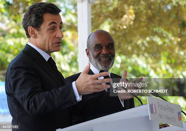 Haitian President Rene Preval smiles as French President Nicolas Sarkozy makes a point during a joint press conference on the grounds of the...