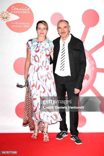 Stefania Rocca and Carlo Capasa attend Convivio photocall on June 5, 2018 in Milan, Italy.