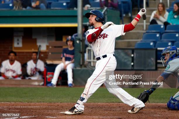 Sea Dogs catcher Austin Rei pauses to watch the sail over the fence for a home run Wednesday at Hadlock Field against the Hartford Yard Goats.