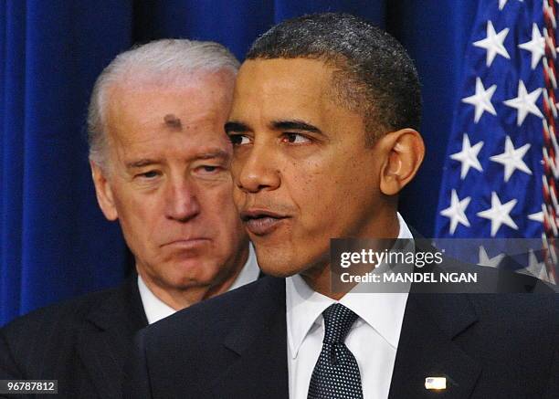 Vice President Joe Biden watches as US President Barack Obama speaks on the economy on the first anniversary of signing the Recovery Act February 17,...