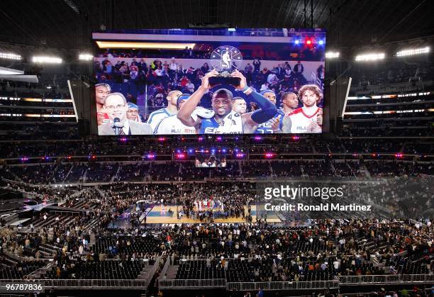 Dwyane Wade of the Eastern Conference celebrates with the trophy after being named the MVP of the NBA All-Star Game, part of 2010 NBA All-Star...
