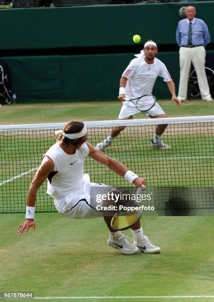 Rafael Nadal of Spain and Marcos Baghdatis of Cyprus during their semi-final match on Day 11 of the Wimbledon Championships, July 7th, 2006.