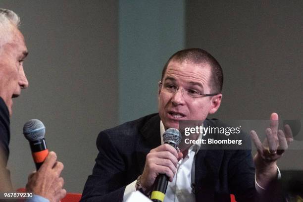 Ricardo Anaya, presidential candidate for the National Action Party , right, speaks while Jorge Ramos, journalist for Univision Communications Inc.,...