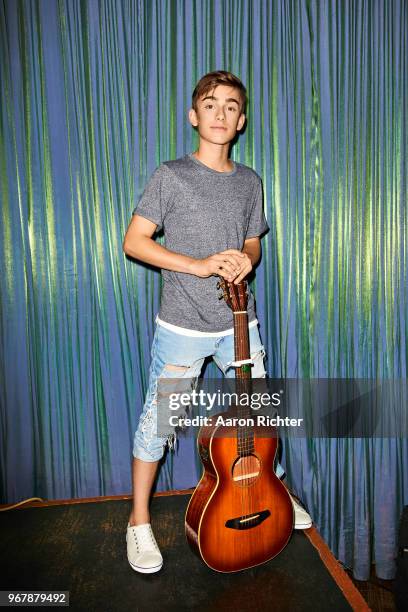 Singer Johnny Orlando is photographed for Tiger Beat Magazine on November 25, 2017 at Sid's Gold Request Room in New York City.