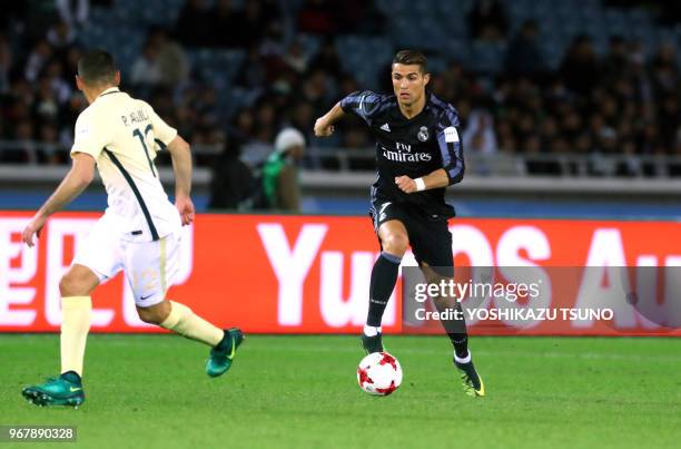 Spain's Real Madrid Cristiano Ronaldo fights the ball against Meixo's Club America Pablo Aguilar diring the semi-final of the FIFA Club World Cup in...